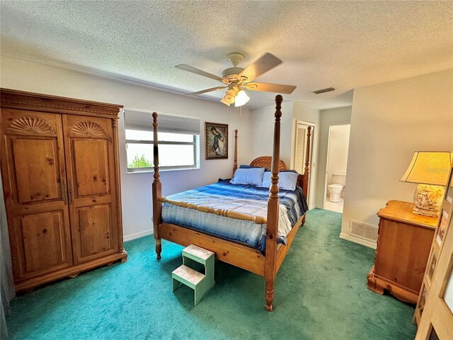 bedroom featuring a textured ceiling, connected bathroom, carpet floors, and ceiling fan