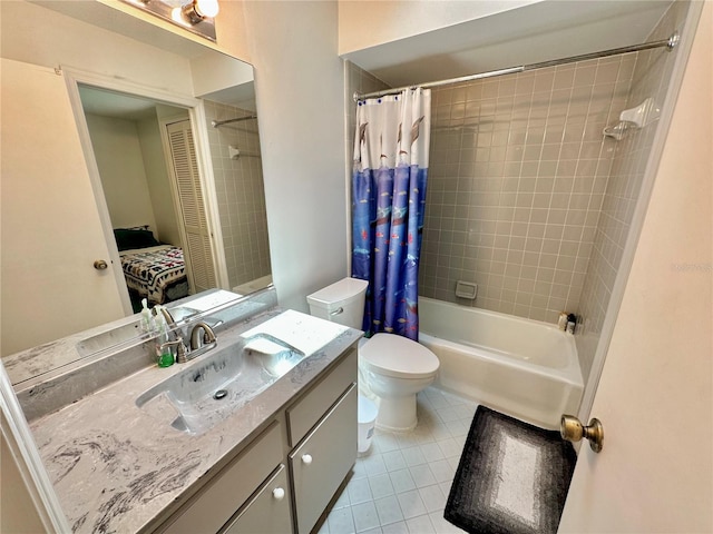 full bathroom featuring tile patterned flooring, toilet, vanity, and shower / tub combo with curtain