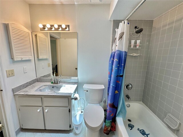 full bathroom featuring vanity, toilet, tile patterned floors, and shower / tub combo