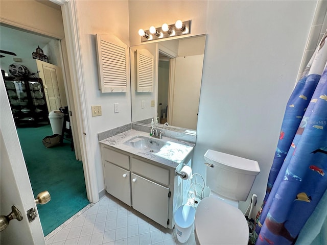 bathroom with tile patterned flooring, toilet, and vanity