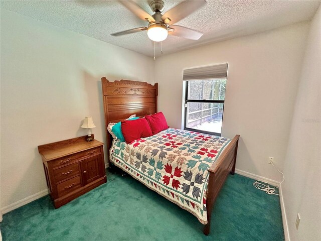 carpeted bedroom with a textured ceiling and ceiling fan