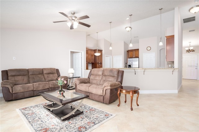 living room with high vaulted ceiling and ceiling fan