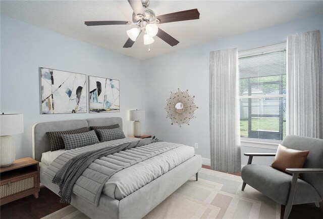 bedroom featuring ceiling fan and light hardwood / wood-style floors