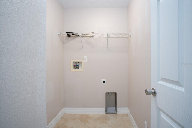 laundry room with light tile patterned flooring, washer hookup, and electric dryer hookup