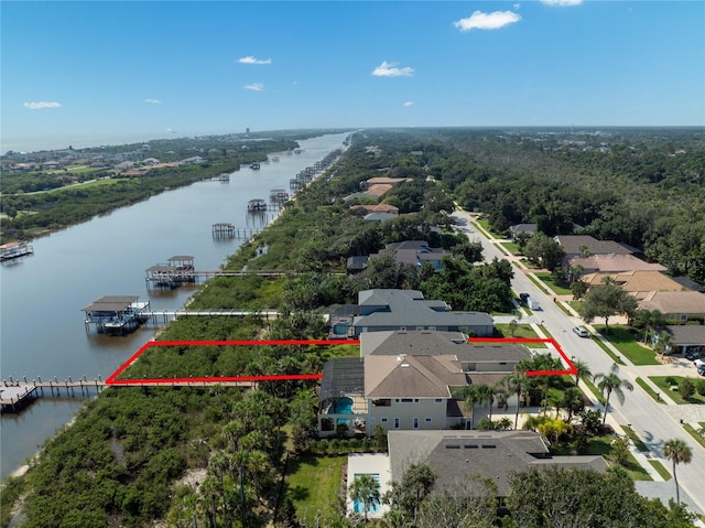 bird's eye view featuring a water view and a residential view