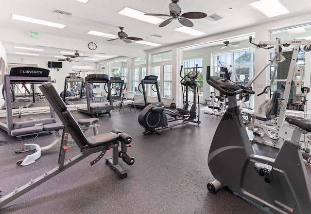 workout area featuring a textured ceiling and visible vents