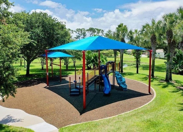 communal playground featuring a yard