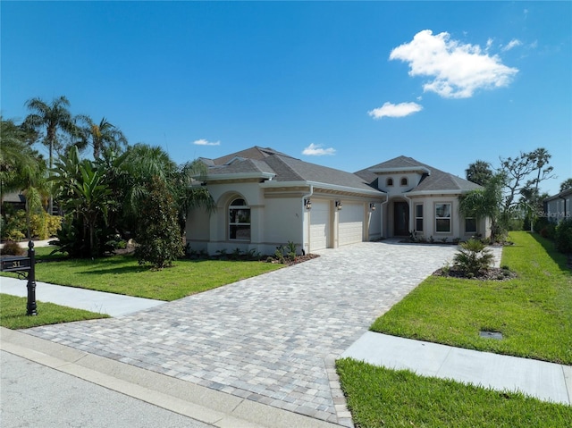 view of front of home featuring a garage and a front lawn