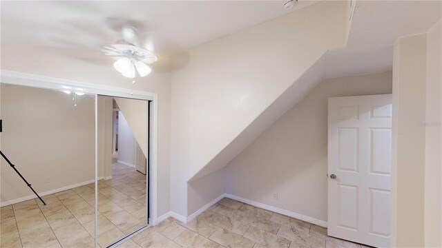 bonus room with vaulted ceiling and baseboards