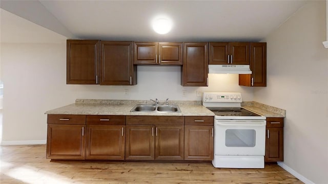 kitchen with white range with electric stovetop, light countertops, a sink, under cabinet range hood, and baseboards