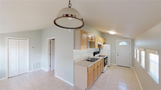 kitchen featuring lofted ceiling, electric range, visible vents, light countertops, and light brown cabinetry