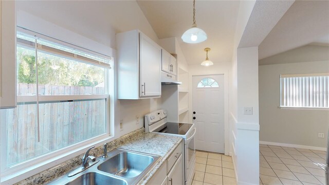 kitchen with white range with electric stovetop, decorative light fixtures, light tile patterned floors, lofted ceiling, and white cabinets