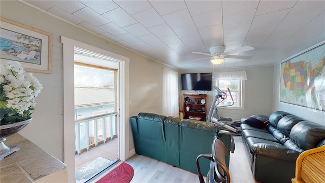 living room featuring light wood-style floors and ceiling fan