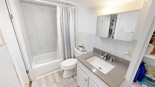 full bath featuring tile walls, shower / bath combination with curtain, toilet, vanity, and wood finished floors