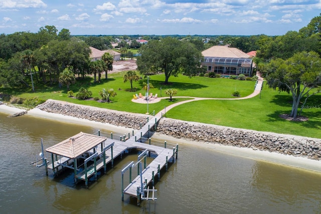 dock area featuring a yard and a water view