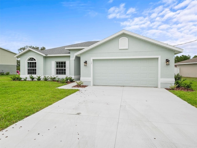 ranch-style home with a front yard and a garage