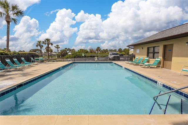 view of swimming pool with a patio