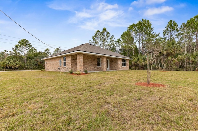 view of side of property featuring a yard