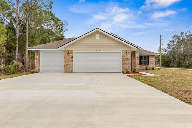 ranch-style home featuring a garage and a front yard