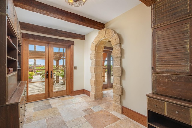 doorway to outside featuring plenty of natural light, french doors, and beamed ceiling