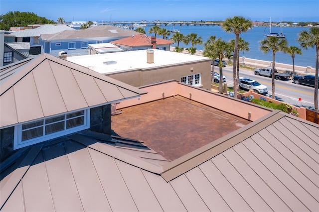 wooden deck featuring a water view