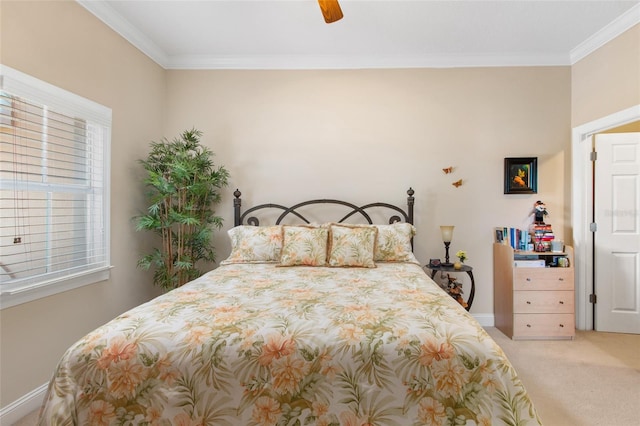 carpeted bedroom featuring ceiling fan and ornamental molding