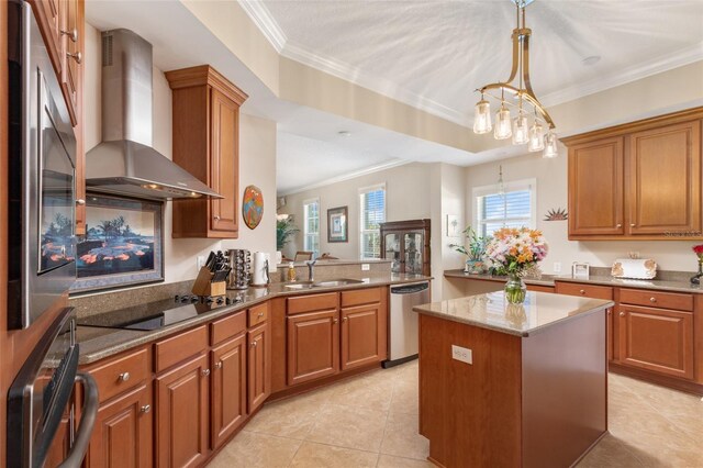 kitchen featuring wall chimney range hood, black electric stovetop, kitchen peninsula, sink, and wall oven