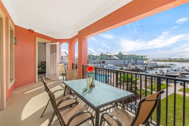 balcony featuring a water view