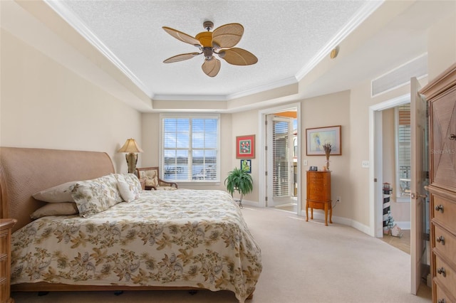 carpeted bedroom featuring ceiling fan, access to outside, a textured ceiling, and a raised ceiling