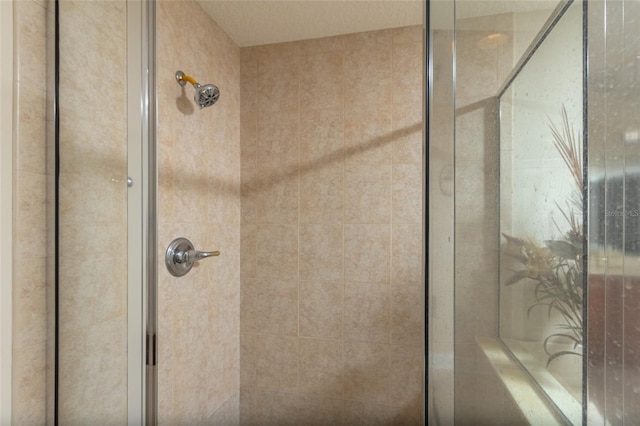 bathroom with a tile shower