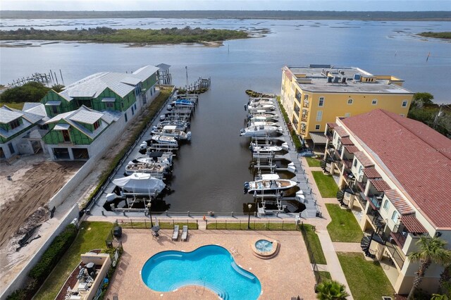 birds eye view of property with a water view