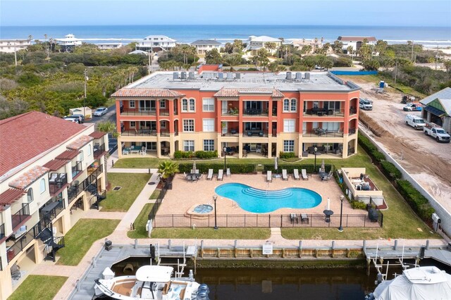 view of pool with a water view