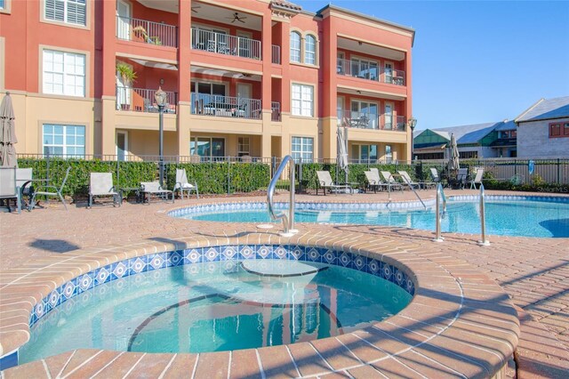 view of pool featuring a hot tub