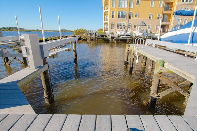 dock area with a water view