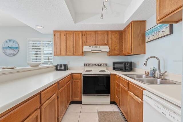 kitchen with a textured ceiling, sink, range with electric cooktop, white dishwasher, and light tile patterned floors