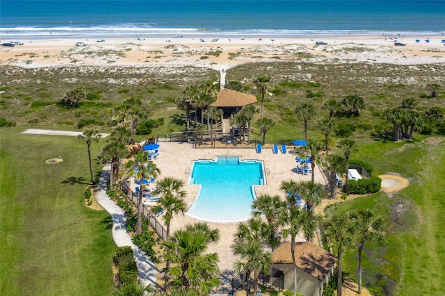 drone / aerial view with a water view and a view of the beach