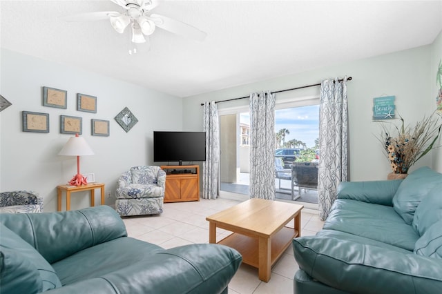 living room with ceiling fan and light tile patterned floors