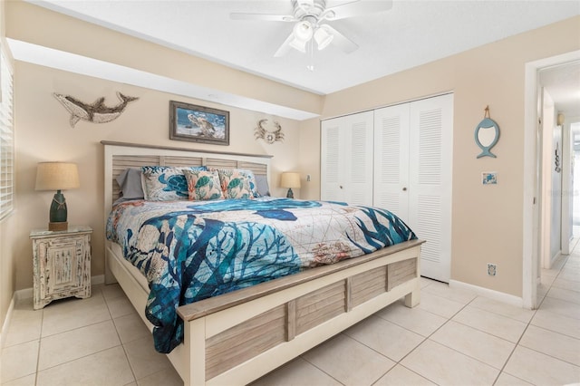 tiled bedroom featuring ceiling fan and a closet