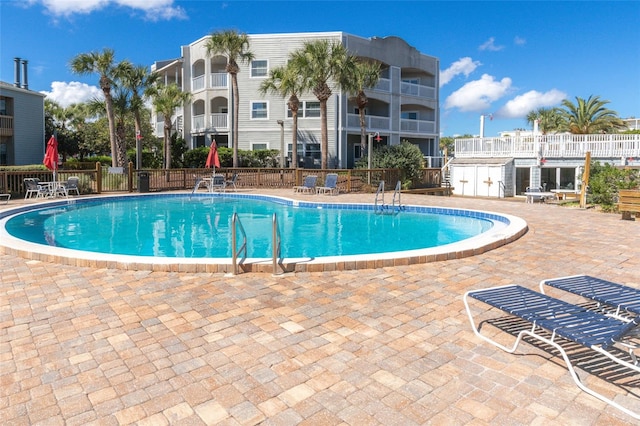 view of swimming pool with a patio area