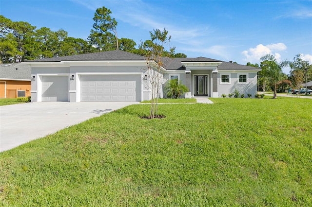 view of front facade featuring a garage and a front yard