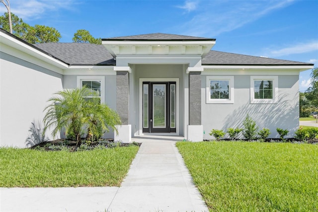 property entrance featuring a lawn