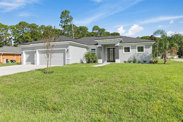 view of front of home with a garage and a front yard