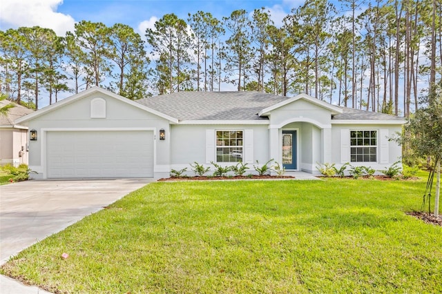 ranch-style house featuring a garage and a front lawn