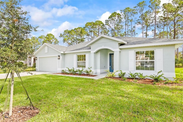 ranch-style house featuring a garage and a front lawn