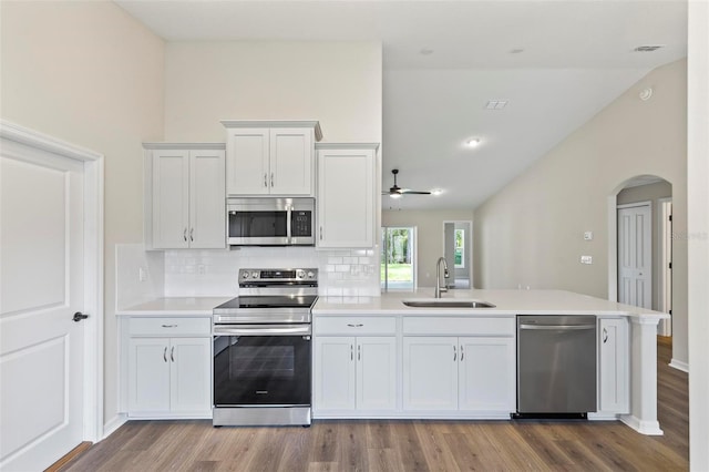 66 Ryland Dr, Palm Coast, FL 32164 - kitchen with sink, white cabinetry, stainless steel appliances, and light wood-type flooring