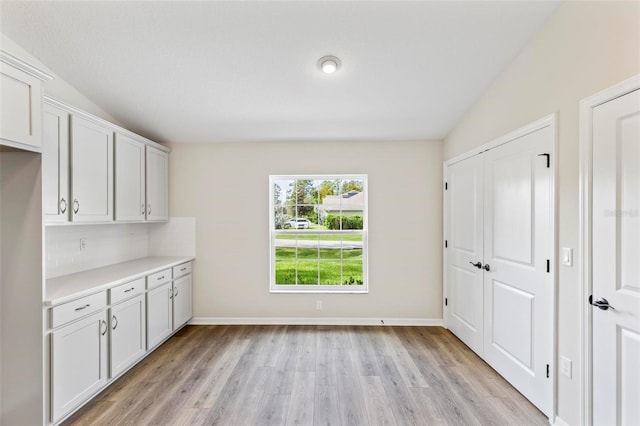 66 Ryland Dr, Palm Coast, FL 32164 - interior space with lofted ceiling and light wood-type flooring