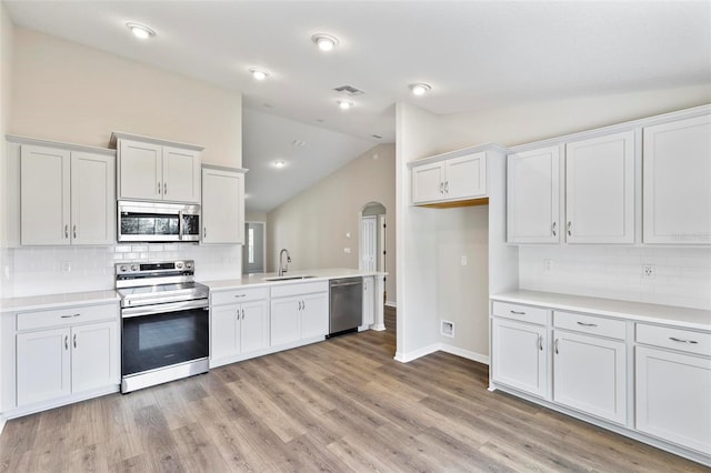 66 Ryland Dr, Palm Coast, FL 32164 - kitchen featuring stainless steel appliances, white cabinetry, and sink