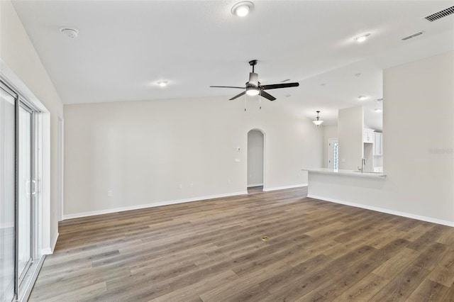 66 Ryland Dr, Palm Coast, FL 32164 - unfurnished living room with ceiling fan, hardwood / wood-style floors, lofted ceiling, and sink
