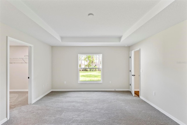 66 Ryland Dr, Palm Coast, FL 32164 - unfurnished room with light colored carpet and a tray ceiling
