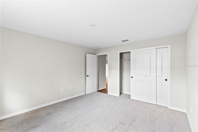 66 Ryland Dr, Palm Coast, FL 32164 - unfurnished bedroom featuring carpet floors and a closet
